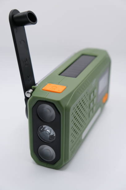 istock Green Solar-Powered Hand-Crank Emergency Radio with Flashlight 2195534932
