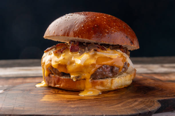 istock Delicious Cheeseburger with Bacon and Melted Cheese 2195535747