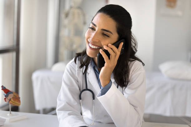 istock Doctor leads conversation with patient by smartphone 2195537096