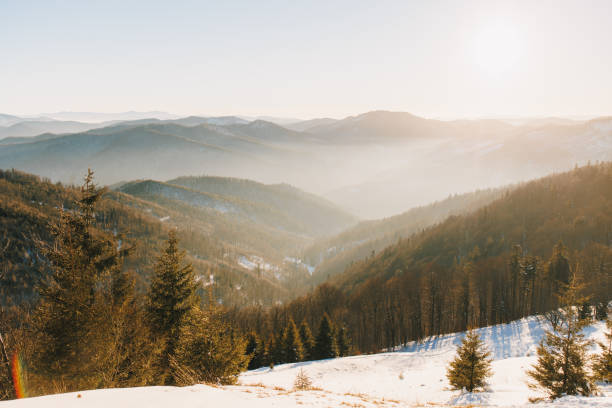 Scenic sunset in the Carpathian Mountains valley in winter