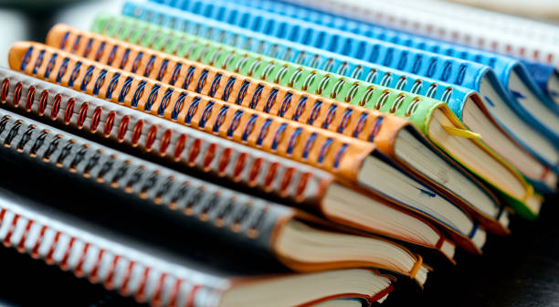 istock Side View of Colorful Spiral-Bound Notebooks in Leather Covers. 2195537846