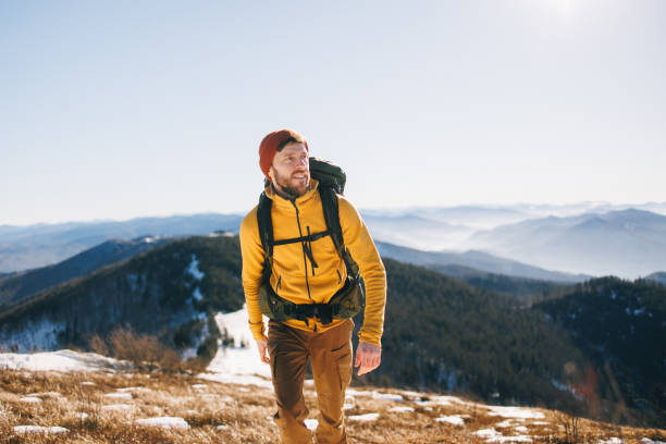 istock Cheerful man, hiking in the mountains in spring 2195538433