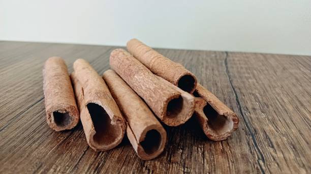 istock Cinnamon sticks on a wooden background. 2195540897