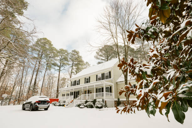 istock Colonial style house covered in snow 2195544275