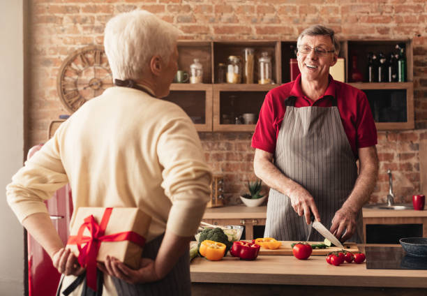 istock Elderly Couple Sharing a Joyful Moment in the Kitchen While Preparing a Meal Together 2195544635