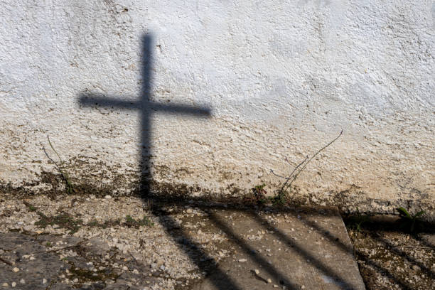 istock Shadow of a cross on a wall, Corfu, Greece 2195544921