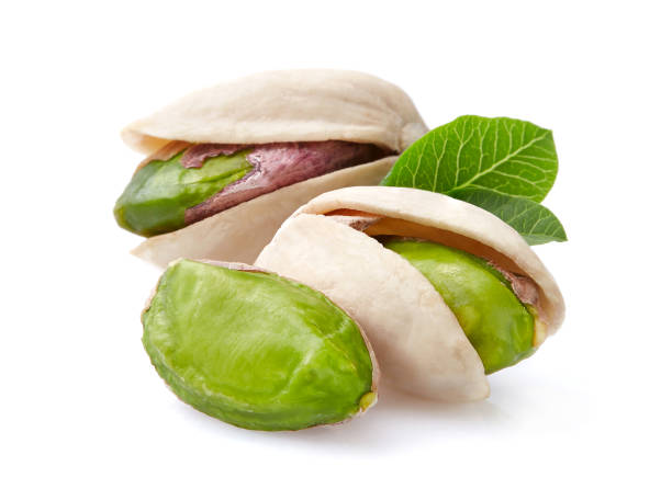 istock Pistachio with leaves in closeup 2195544985