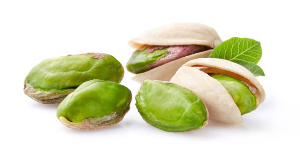 istock Pistachio with leaves on white background 2195544991