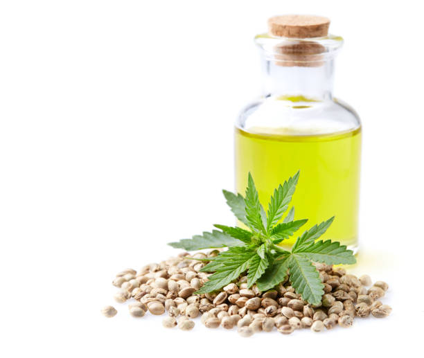 istock Hemp oil with hempseeds on white background 2195544992
