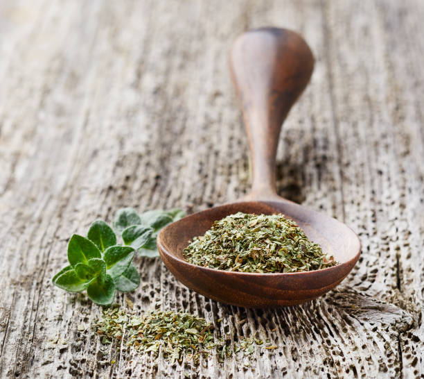 istock Oregano plant on wooden background 2195550060