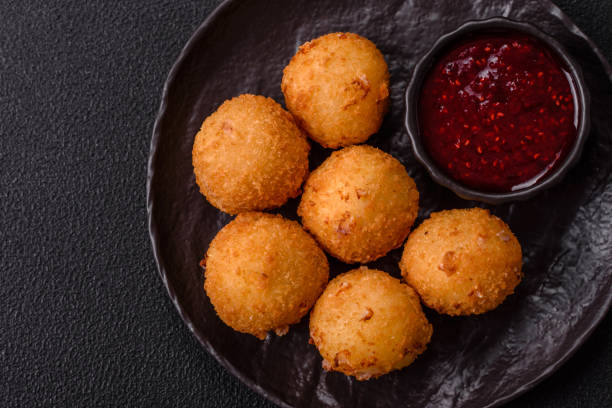 istock Crispy French fries with mozzarella cheese with raspberry sauce 2195551091