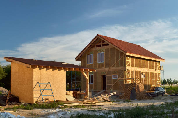 istock Construction of a new and modern energy-efficient straw house. 2195555281