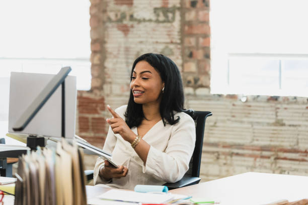 istock Confident Businesswoman Using Laptop in Modern Office 2195557684
