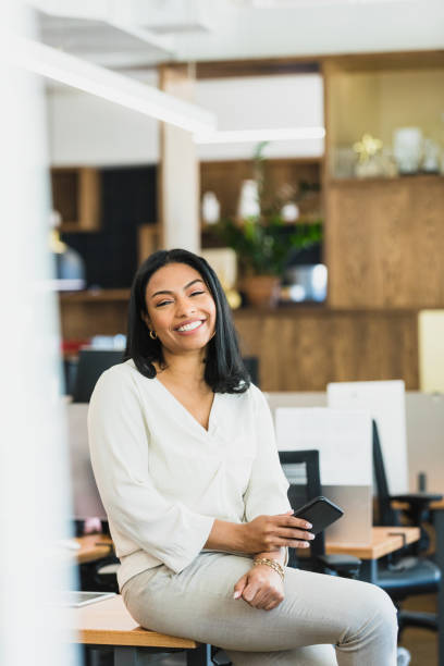 istock Confident Businesswoman Smiling in Modern Office 2195557689