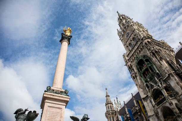 Marian column at Marienplatz, pedestrian zone in Munich, Bavaria, Germany in summertime