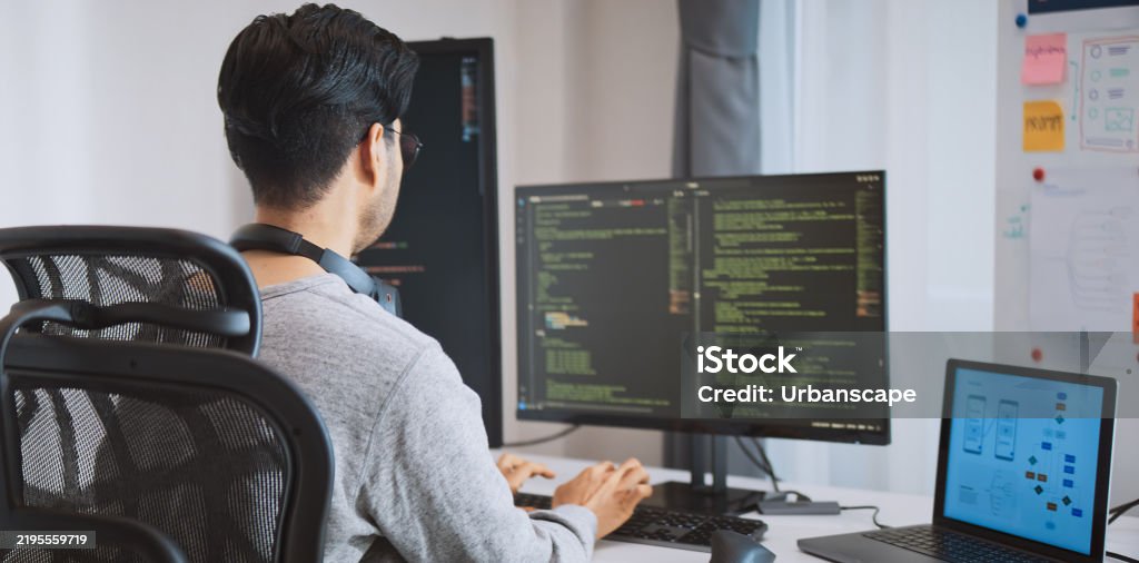 Young Adult Asian Male Software Developer Coding Program On Desktop ...