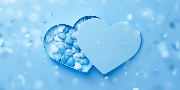 istock Blue opened heart-shaped box with blue hearts inside on a background with blurred flying hearts. Valentine's day romantic concept. 3d render illustration 2195560150
