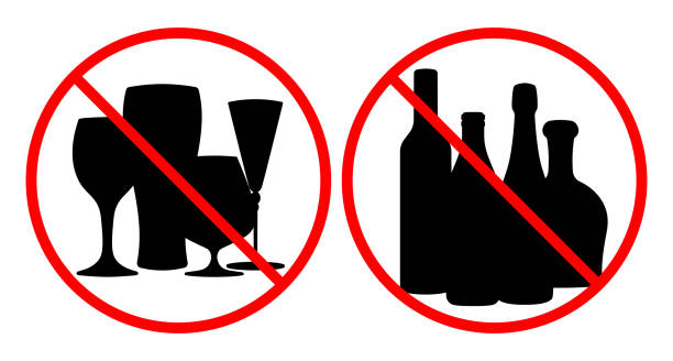 istock Prohibited alcohol consumption signs. Vector illustration of bottles of drinks and glasses with red prohibition circle, symbolizing no drinking allowed 2195562432