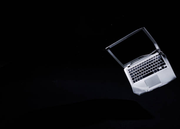istock Device crashing on the floor, a smashed and broken laptop, locked down shot 2195563633