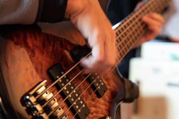 istock Electric bass guitar practice, close-up 2195564525