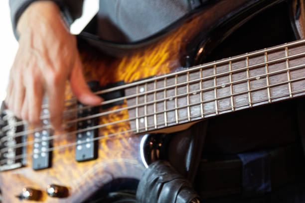 istock Electric bass guitar practice, close-up 2195564700