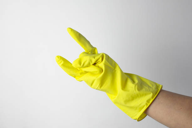 istock Cleaning glove making rock gesture. Housekeeping concept 2195565082