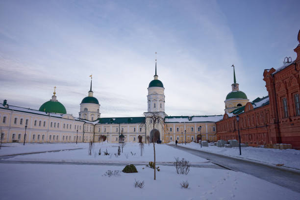 istock Large building with a green dome sits in a snowy courtyard 2195566513