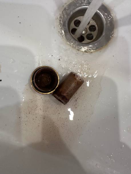 istock Sink with a drain and a metal object in it 2195567225