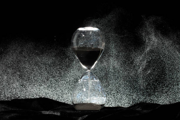 istock Sands Hourglass of time were running low; death crept closer with every passing second. Hourglass was about to empty; seize remaining moments, death was close on time management 2195568520
