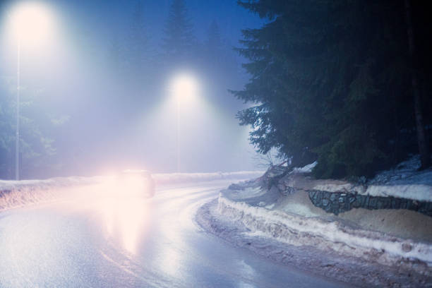 istock Difficult foggy and snowy night time for driving 2195569998