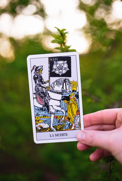 istock Tarot card held in a hand in nature 2195572684