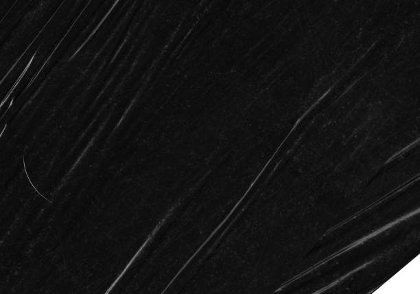 istock Black transparent plastic wrap texture overlay background. Realistic plastic for poster design and photo overlay effect. Wrinkled paper surface pattern for graphic design sources and element mockup. 2195573790