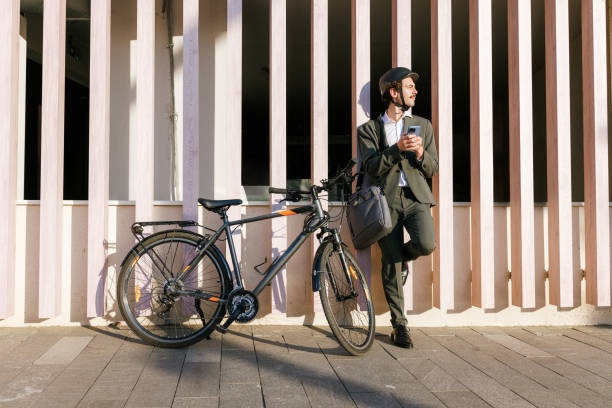 istock Quick Check-in During an Urban Commute - Man checking his phone 2195574738