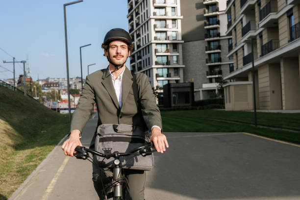 istock Front view of a man riding a bike. Eco-Friendly Commute. 2195574772