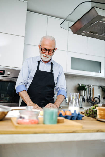istock Handsome senior chef working as food vlogger 2195575190