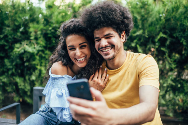istock Latino couple enjoying outdoors at beautiful sunny day 2195576131