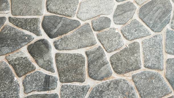 istock Close-up of a gray cobblestone pavement. 2195576240
