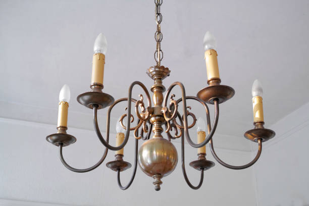 istock Elegant Antique Chandelier with Multiple Bulbs in an Interior Setting 2195579853