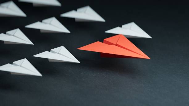 istock Business concept for new ideas creativity, innovative solution and Leaderplane concept with black paper plane leading among white.3D rendering on black background. 2195580278