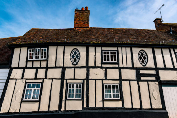 Close crop photo of an ancient Tudor era building in Henley Oxfordshire England with black beams and whitewashed walls