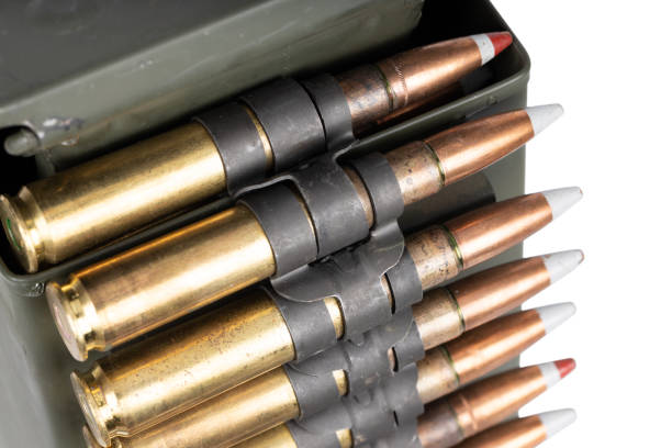 istock .50 BMG caliber machine gun ammunition belt with cartridges in ammunition can. 2195588685