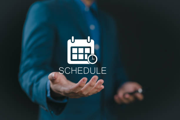Person holding schedule icon on virtual screen for agenda meeting plan schedule in personal organizer and agenda meeting appointment activity information.