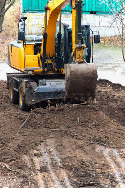 istock Excavator work in dust and dirt: heavy machinery works tirelessly on the construction site. 2195589358