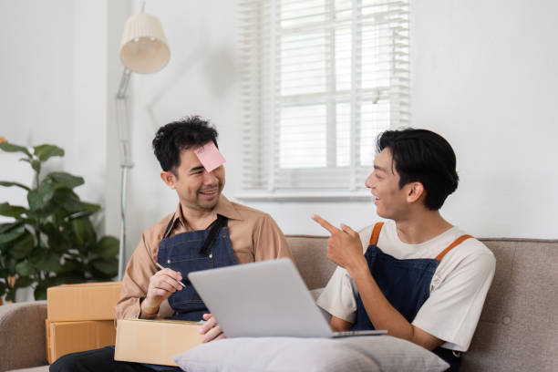 istock Business partners sharing a light moment while brainstorming ideas in their home office 2195593756