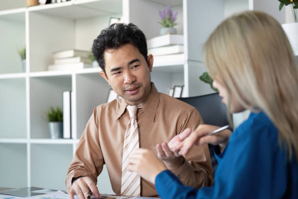 istock Business professionals discussing strategies in a modern office setting 2195594873