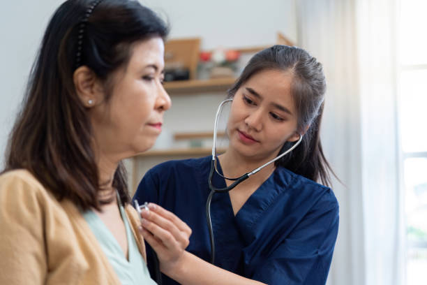 istock Caregiver using a stethoscope to examine elderly patient during health assessment 2195594972