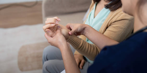 istock Caregiver examining elderly patient for symptoms of disease during a compassionate check up 2195594986
