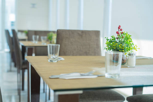 A table with glasses and cutlery on it