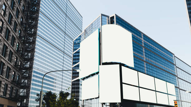 istock Large billboard with a white screen for advertising on the building wall. 3D illustration 2195595873