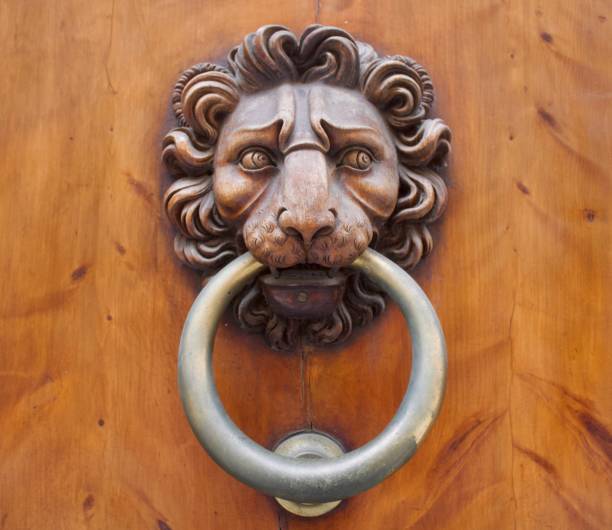 istock Scared Lion Metal and Wood Door Knocker 2195598446